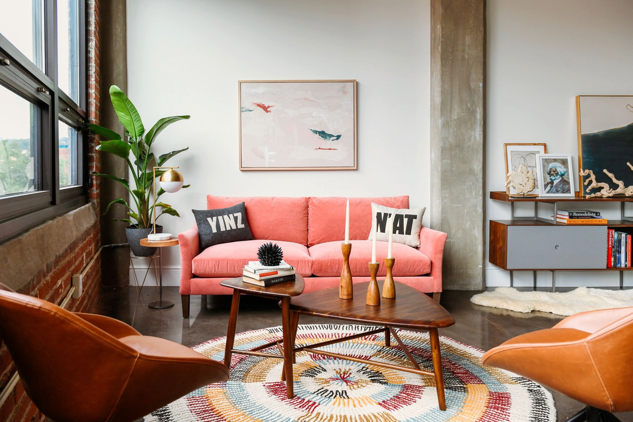 A cozy living room with a comfortable couch, seats, and a fluffy rug. At PerLora, a furniture store in Pittsburgh.